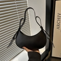 Minimalist black crescent shoulder bag with bow detail and matte leather finish - Black