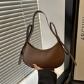 Deep coffee brown crescent shoulder bag with vintage bow accents and metallic eyelets - Brown
