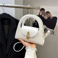 Modern white leather semi-circle handbag with golden clasp and hollow round handle - White