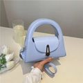 Minimalist semi-circle light blue handbag with vintage metal lock and wide top handle - Blue
