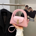 Pink semi-circle matte leather handbag with a circular hollow handle and gold buckle - Pink