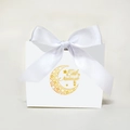 White festive candy box with golden moon and stars patterns and a large satin bow - White