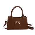 Brown faux leather crossbody bag with a golden bow ornament and adjustable strap - Brown