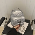 Silver quilted mini backpack with metal chain straps and classic turn-lock closure - Silver