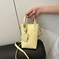 Minimalist light yellow crossbody bucket bag with cartoon puppy charm and top handles - Light Yellow