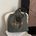 Dark green nylon tote bag with orange lettering and drawstring closure for daily wear - Green