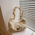 Beige pleated crescent bag with canvas texture and silver butterfly pendant detail - Off White
