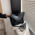Minimalist black bucket tote bag in premium faux leather with long shoulder strap - With Pendant / Black