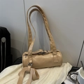 Minimalist light brown baguette cylinder bag with silver metal buckles on white fabric - Khaki