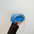 Vibrant blue mini pillow bag with iconic gold C-shaped handle and metal chain strap - Blue