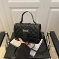Classic black quilted crossbody bag with silver hardware and versatile top handle - Black