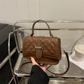 Brown quilted crossbody bag with rhombic stitching and silver buckle detail - Coffee