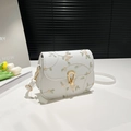White square shoulder bag featuring floral embroidery and gold horseshoe buckle - White