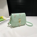 Mint green mini crossbody bag with delicate floral embroidery and gold metal clasp - Green