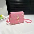 Pink leather crossbody bag with delicate floral embroidery and golden horseshoe clasp - Pink