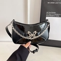 Chic black butterfly half-moon shoulder bag with silver chains and matte leather finish - Black