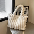 Chic faux fur handbag in cream white featuring a plush bobble handle and striped texture - Off White