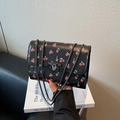 Fashionable black crossbody bag with cherry prints and gunmetal chain strap - Black