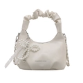 White crescent handbag with ruched cloud handle and pearl bow charm detail - White
