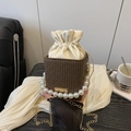 Brown monogram bucket bag with elegant pearl handle and golden chain strap - Brown