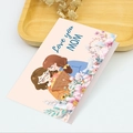 Detailed view of hand-drawn Mother's Day card with Love you MOM text on a wooden tray - S560-5