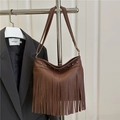 Brown tassel crossbody bag with pebble grain faux leather and metal rivet details - Brown