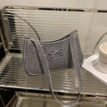 Glinsterende zilveren hobo tas met strasstenen, elegante strik en brede schouderband - Grijs
