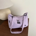 Lavender purple nylon crossbody bag with adjustable strap and waterproof fabric design - Purple