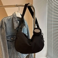 Minimalist black crescent canvas crossbody bag with small round pouch accessory - Black