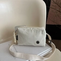 Chic cream nylon crossbody bag with adjustable wide strap and metallic M logo detail - White