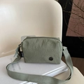 Minimalist Morandi green nylon shoulder bag with adjustable strap and metal M logo - Green