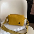 Waterproof nylon crossbody bag in mustard yellow with adjustable strap and metal M logo - Yellow