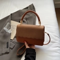 Caramel crossbody bag with woven texture lid and elegant braided top handle - Brown