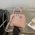 Pink woven texture shell bag with silver hardware and adjustable shoulder strap - Pink