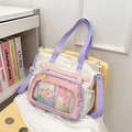 Chic multi-color canvas tote bag with transparent front pocket on a yellow chair - Off White