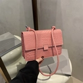 Pink crocodile embossed flap shoulder bag with textured finish and woven strap - Pink
