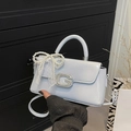 Detail of light blue patent leather handbag with rhinestone G buckle and lace bow - No Pendant / Blue
