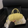 Chic yellow glossy patent leather baguette bag with top handles and silver hardware - Yellow