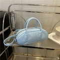 Light blue minimalist pillow bag with smooth faux leather finish and adjustable strap - Blue