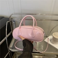 Pink minimalist pillow bag in glossy PU leather with top handles and shoulder strap - Pink