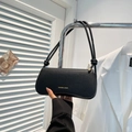 Chic black litchi grain leather underarm bag with yellow logo and knotted rope strap - Black