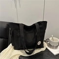 Black canvas tote bag with good luck embroidery and multiple utility pockets - Black