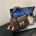 Chic brown ruched tote bag with a metallic silver bow detail and comfortable handles - Brown