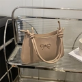 Minimalist beige shoulder bag with a gold bow metal piece and knotted strap design - Khaki