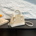Elegant beige woven shell bag with white leather trim and gold-tone hardware detail - Off White