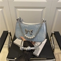Blue denim underarm bag with silver bow, pearl chain and sparkling glitter finish - Light Blue