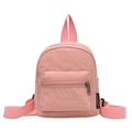 Minimalist pink nylon mini backpack for women featuring zipper pocket and web handles - Pink
