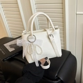 Elegant white lychee leather handbag featuring pearl bow and lace ribbon accessory - With Pendant / White