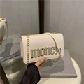 Fashionable beige crossbody chain bag with metallic gold letter accent in a modern style - White