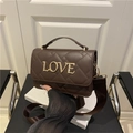 Dark brown quilted handbag with golden LOVE logo and wide fabric shoulder strap - Brown
